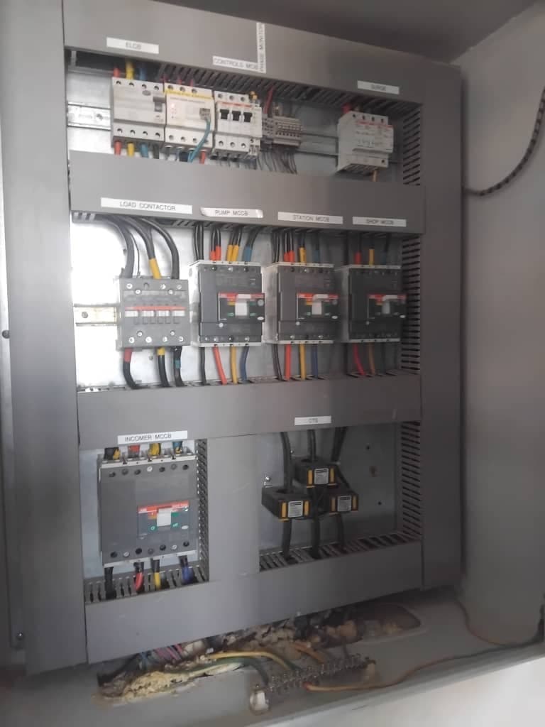 Station electrical control panel with MCCBs, contactors, and labelled circuits